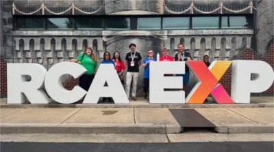 Charter school educators pose for a photo outside the Ron Clark Academy in Atlanta. 