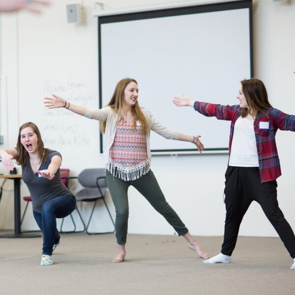 Local high school students practicing theatrical movements.