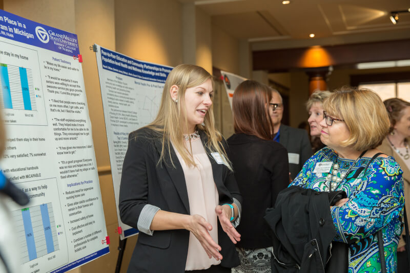 poster presentation, two women 