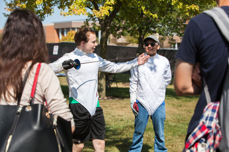 Grand Valley's Fencing Club demonstrating sword fighting techniques during the Paleo-Olympic Games.