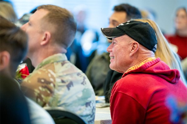 Attendees of 13th Annual Veterans Breakfast listen to a speaker.