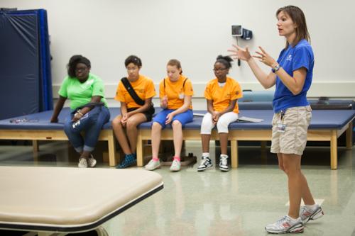 Laurie Stickler, assistant professor of physical therapy, introduces sHaPe campers to the profession.