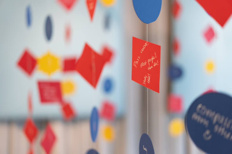 colorful shapes of paper with short phrases