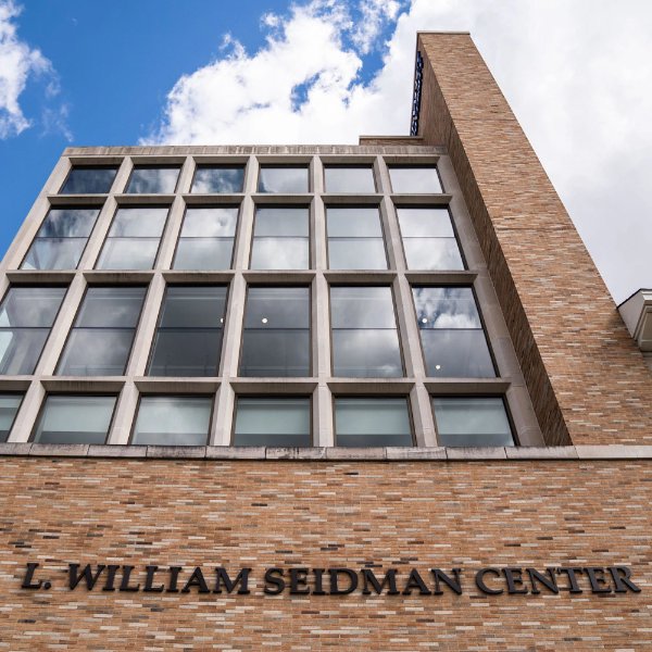 the L. William Seidman Center with background of blue sky, white cloud