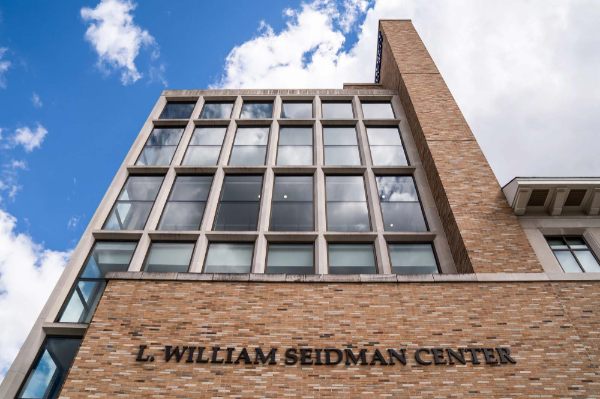 the L. William Seidman Center with background of blue sky, white cloud