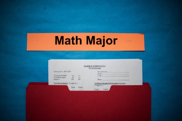 Photo of forms in a pocket on a wall underneath the words, "math major"
