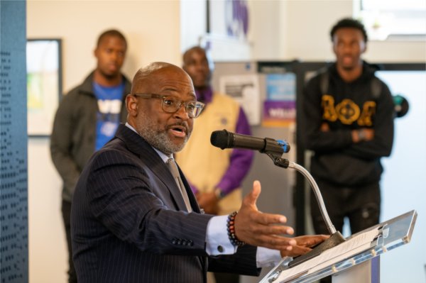 VP Truss at podium, people in background
