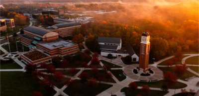 The carillon is at the center of an image of the Allendale Campus during sunrise.