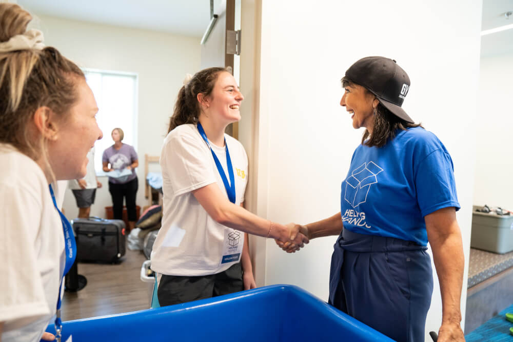 GVSU President Philomena Mantella greets students during move-in.