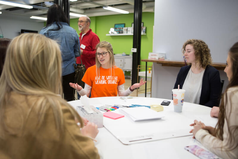 Grand Valley students working with the Kids' Food Basket representative during the CreateAthon.