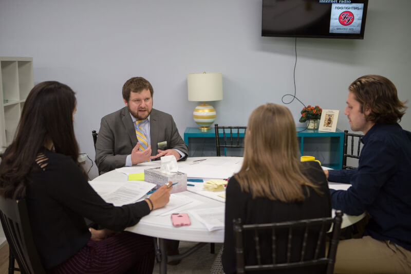 GrandPR staff members consulting with a client during the CreateAthon.