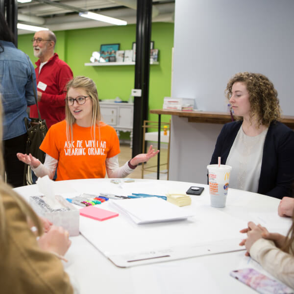 Grand Valley students working with the Kids' Food Basket representative during the CreateAthon.