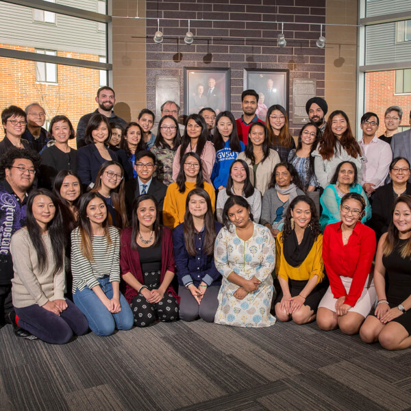 large group of people standing and kneeling for photo