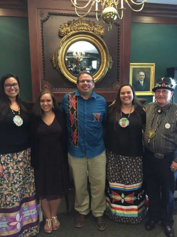 five people standing