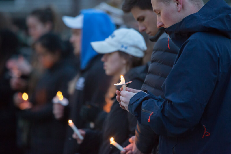 About 100 people gathered at the Cook Carillon Tower for a candlelight vigil to honor the victims of the Parkland, Florida, high school shooting.