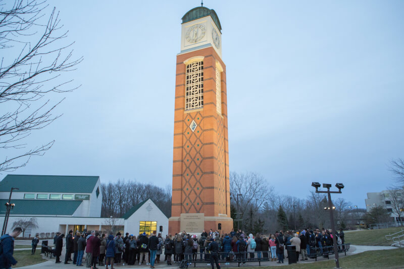About 100 students, faculty and staff members attended a candlelight vigil to honor the victims of the Parkland, Florida, high school shooting.