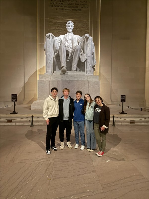 five students in front of Lincoln Memorial