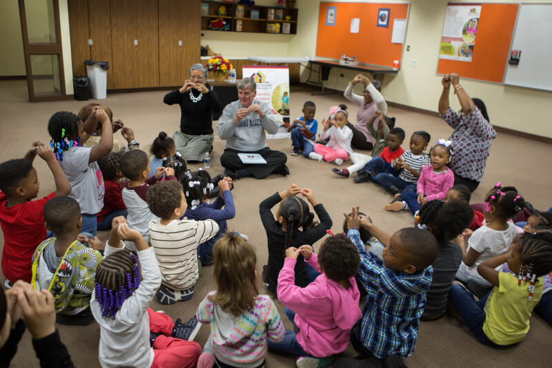About 40 preschool students at Explore and Learn Academy in Grand Rapids sat on the floor with President Thomas J. Haas to hear all about The Sandwich Swap.
