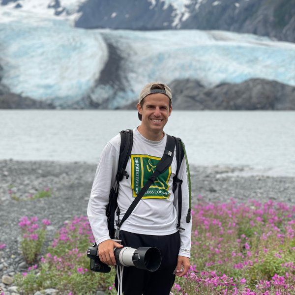 Grand Valley graduate Joseph Hausler smiles for a photo at Portage Lake in Alaska