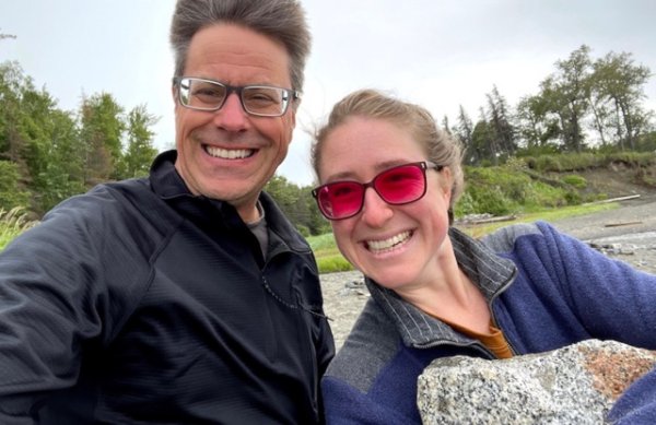 Faculty member Shawn Bultsma and graduate Nicole Lyke smile for a photo along Cook Inlet in Alaska.