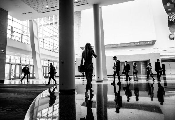 Black and white image of people in business clothes.