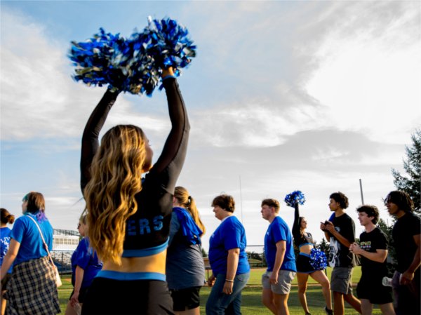 GVSU Laker Dance Team members cheer as students pass by during Laker Kickoff August 22. 