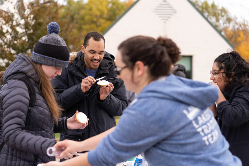 students frost cookies