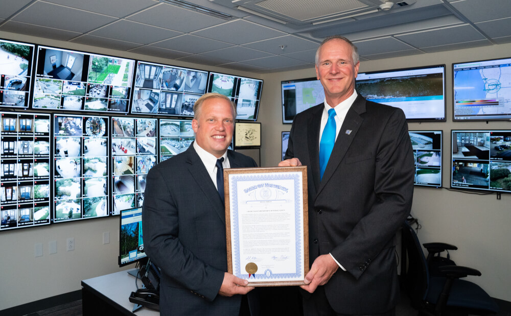 State Rep. Luke Meerman, R-Polkton Township, presents a plaque to Police Chief Brandon DeHaan.