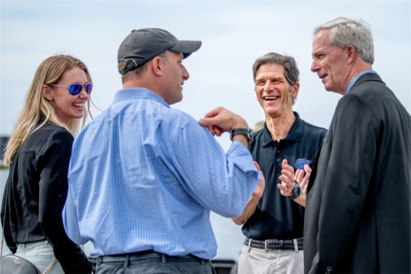 A group of people talking and laughing.
