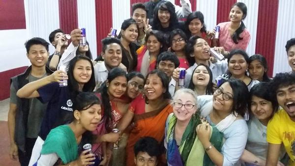 Libman pictured with B. Borooah College students following a performance.