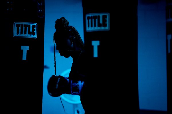 A student's profile is silhouetted in the boxing gym at the Recreation Center. 