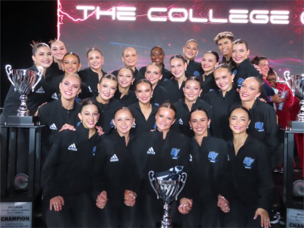 Laker Dance Team on stage with two trophies