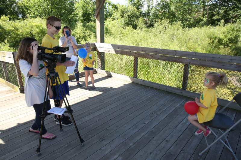 Members of the Allendale Robotics Team recording interviews that were placed in a time capsule.