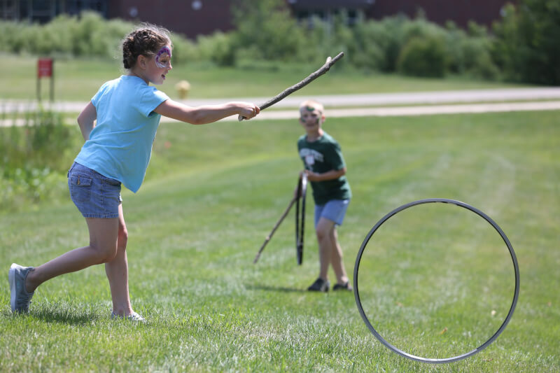 Kids enjoyed old fashioned games, such as hoop trundling.
