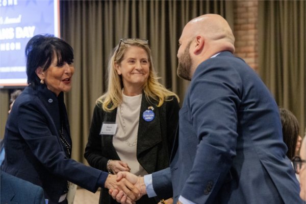 GVSU President Philomena V. Mantella and Vice President and Chief Public Affairs Officer Stacie Behler greet attendees of the luncheon