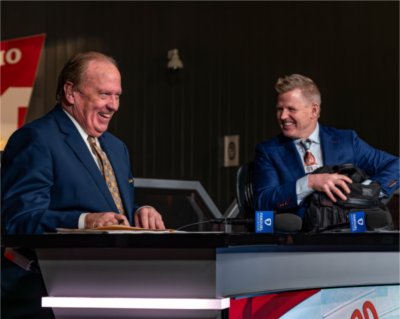 John Keating on stage with broadcast partner Chris Osgood