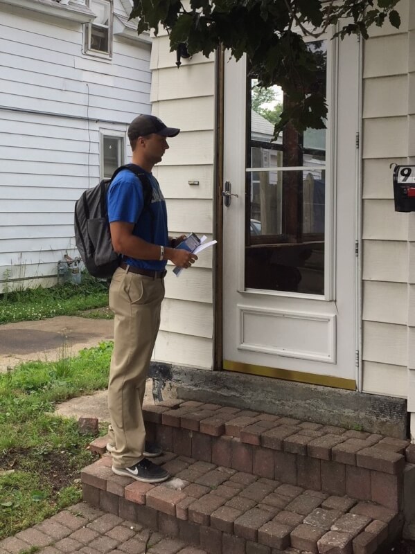 Nearly 40 students in the GVSU Police Academy joined members of the John Ball Area Neighborhood Association and the Grand Rapids Police Department June 23 to hand out nearly 875 LED light bulbs and crime prevention brochures to residents of the West Side.