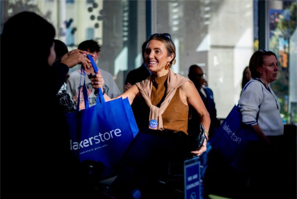Mindy Kalinowski Earley, '01 and '08, makes a purchase at the store October 16 during the launch of Philly's Faves.