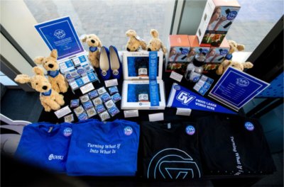 table of Philly's Faves products, plush dogs, t-shirts, lapel pins, pennants and a photo book