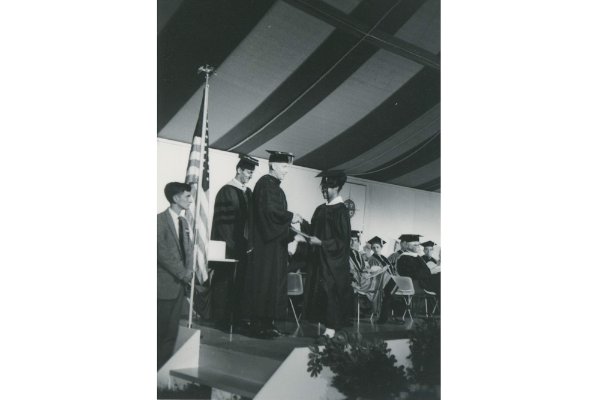 a Black student receives a diploma during the 1967 commencement 