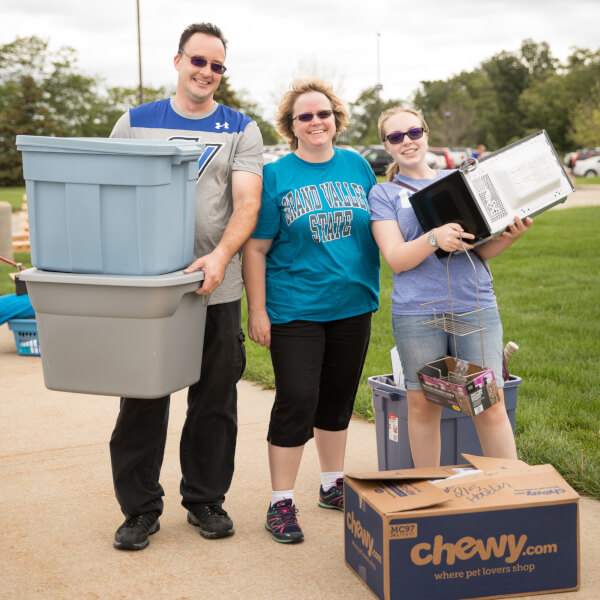 A photo of family members and a student moving in last year.