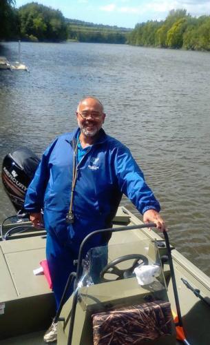 John Bancheri in the Grand Valley rowing coach boat, which he calls his desk.