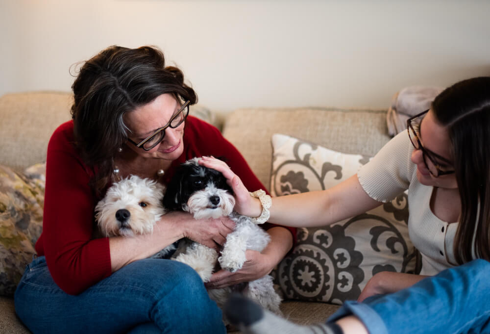 Kathy Hunter, a psychiatric mental health nurse practitioner (PMHNP) for GVSU's Counseling Center, is pictured with her dogs and daughter.