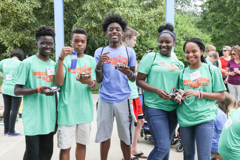 Campers pictured with their solar-powered cars.
