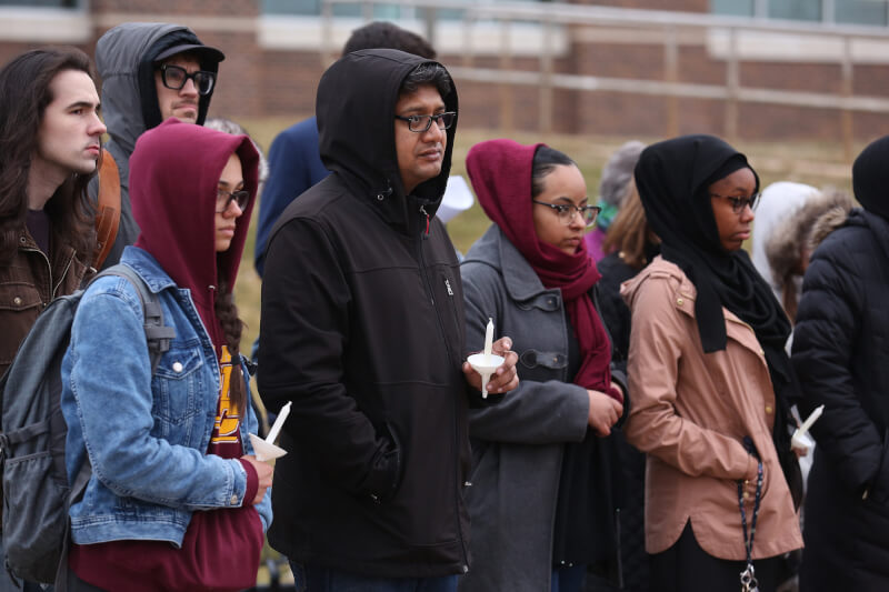 About 100 students, faculty and community members gathered March 21 to honor the victims.