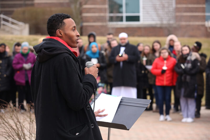 Mohamed Abdirahman, from the Muslim Students Association, speaks at a vigil to remember victims of New Zealand shootings.