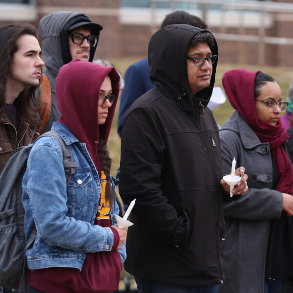 About 100 students, faculty and community members gathered March 21 to honor the victims.