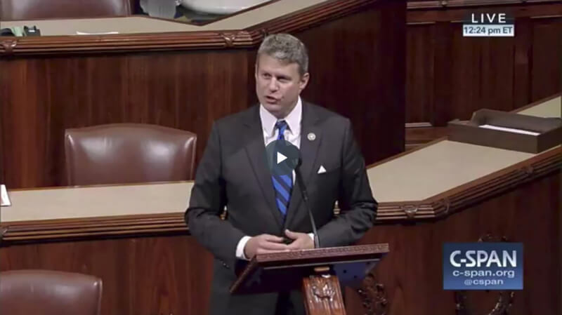 Rep. Bill Huizenga stands behind a podium in congress.