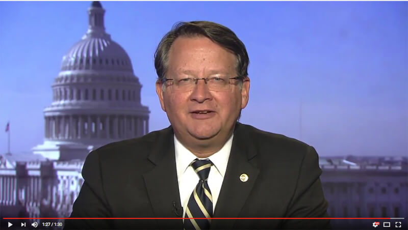 man speaking on video