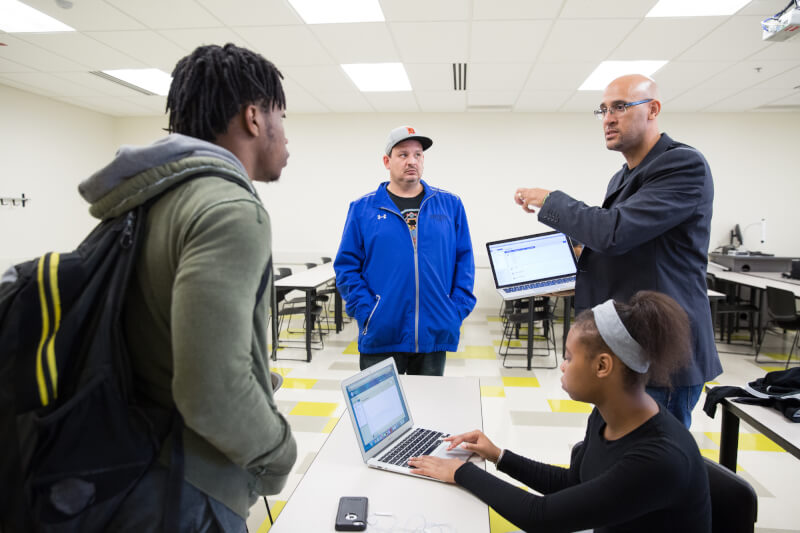 Louis Moore (right), associate professor of history, will kick off Black History Month February 1.